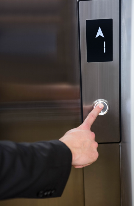 Installed elevator landing call panel in use