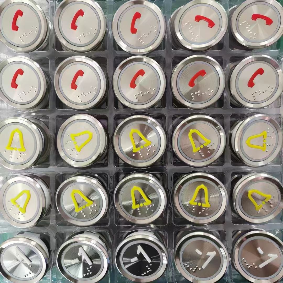 Elevator buttons with varied characters and symbols arranged in a tray