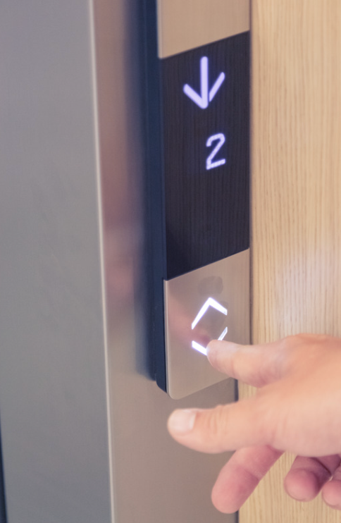 Installed elevator landing panel in use